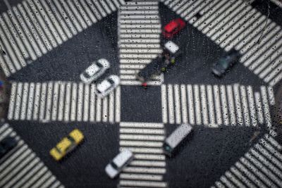 High angle view of street crossing sign on road