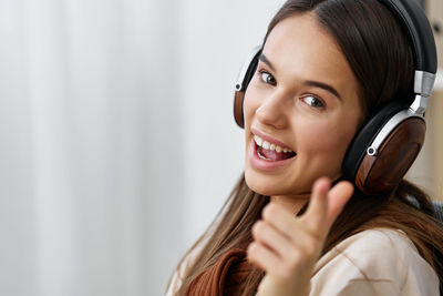 Portrait of young woman using mobile phone