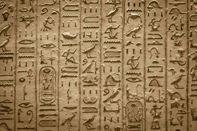 Full frame shot of carvings on brick wall