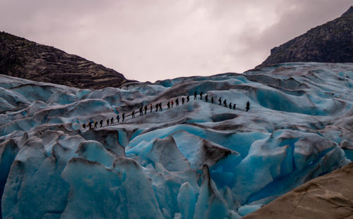 Scenic view of frozen lake against sky