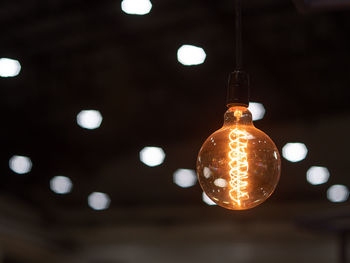 Low angle view of illuminated light bulb