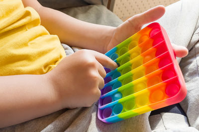 Close-up of baby boy holding toy