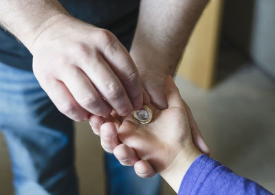 Close-up of man holding hands