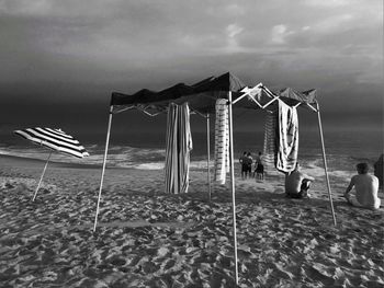 Man on beach against sky