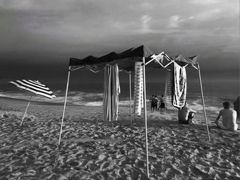 Man on beach against sky