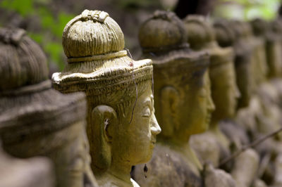 Close-up of religious sculptures in row
