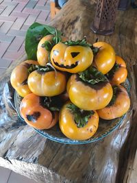 High angle view of fruits in basket on table