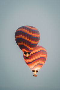 Low angle view of hot air balloon against clear sky