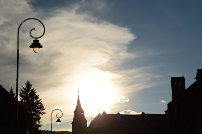 Low angle view of silhouette buildings against sky during sunset