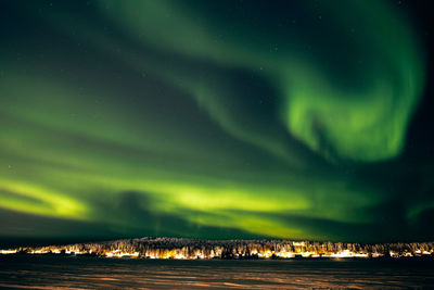 Scenic view of sea against sky at night