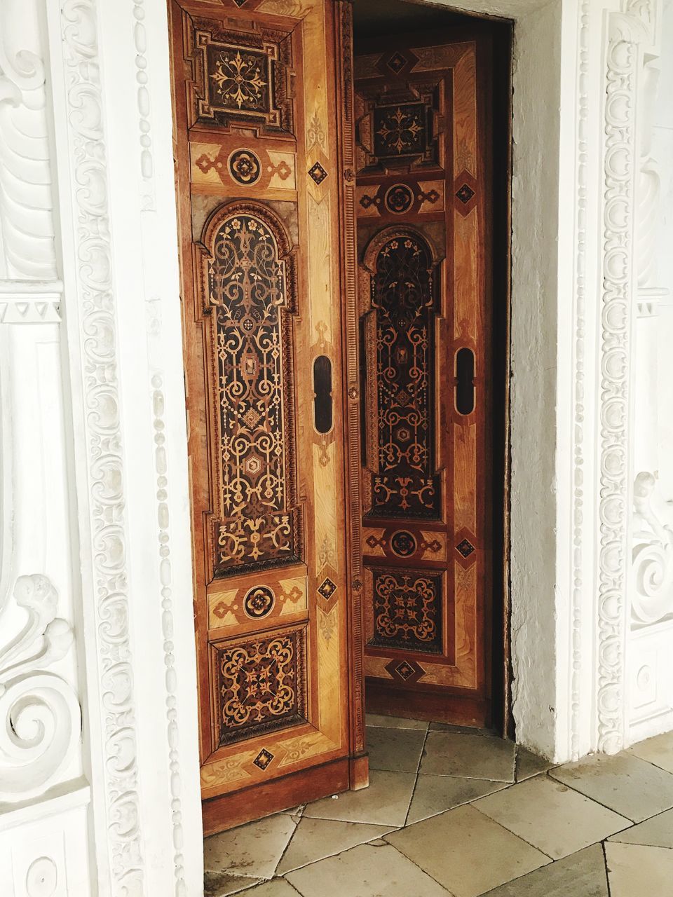 entrance, door, architecture, built structure, building, indoors, pattern, no people, design, closed, day, creativity, house, home interior, open, art and craft, doorway, front door, ornate, floral pattern
