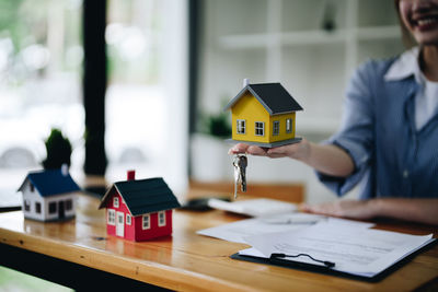 Midsection of businessman working on table