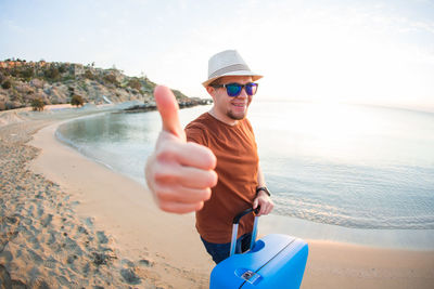 Man wearing sunglasses on beach