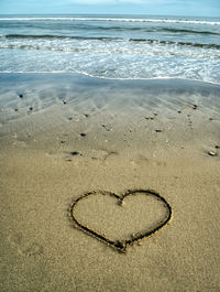 Heart shape on sand at beach