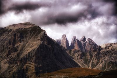 Panoramic view of mountains against cloudy sky