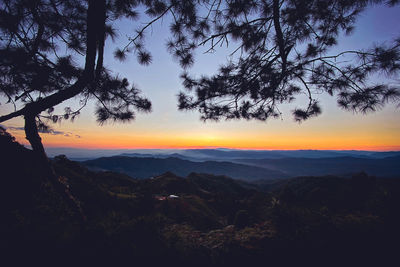 Scenic view of silhouette landscape against sky during sunset