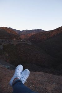 Low section of man on mountain road