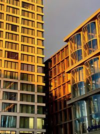 Low angle view of modern buildings against clear sky