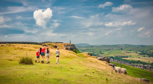 Scenic view of landscape against cloudy sky