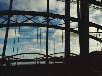 View of cityscape against cloudy sky