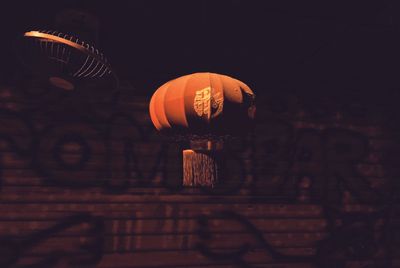 Illuminated lantern at night