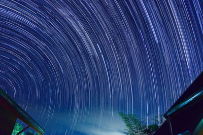 Low angle view of illuminated sky at night