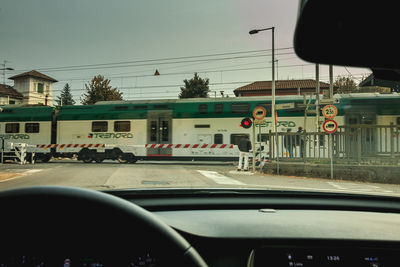 Cars on street seen through windshield