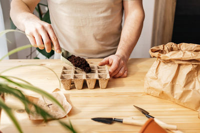 Midsection of man preparing food