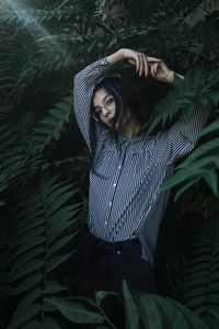 High angle portrait of young woman relaxing in park