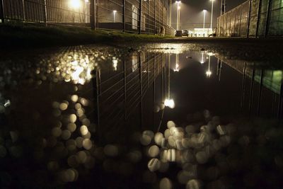 Reflection of illuminated buildings in water