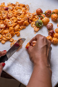 Cropped hands of person preparing food