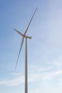 Low angle view of wind turbine against sky