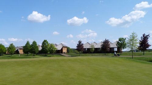 View of golf course against sky