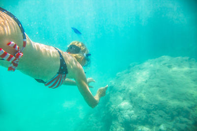 Woman swimming in sea