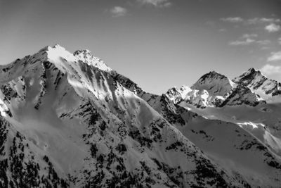 Panoramic view of snowcapped mountains against sky