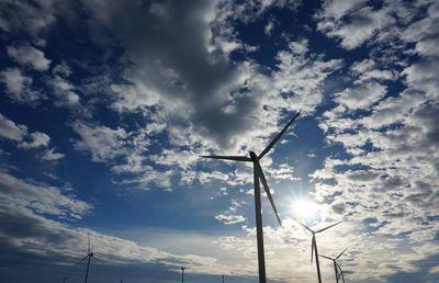 Low angle view of wind turbine against sky