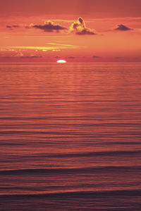 Scenic view of sea against romantic sky