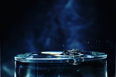 Close-up of water splashing against black background