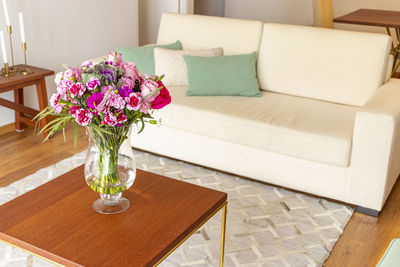 Flower vase on table at home