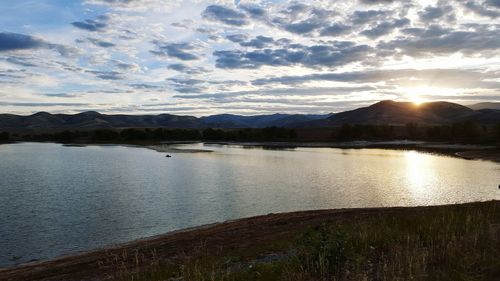 Scenic view of lake against sky during sunset