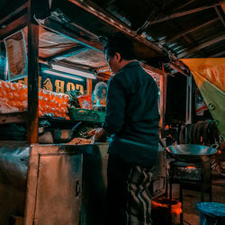 Man working at market stall