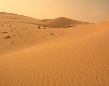 Scenic view of desert against clear sky