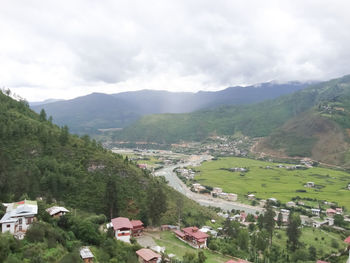 High angle view of village against mountains