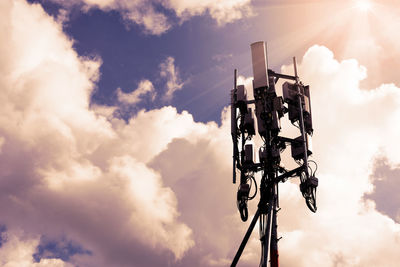 Low angle view of camera against sky