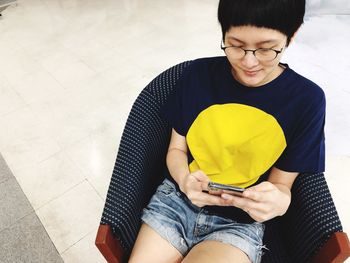 High angle view of woman using mobile phone