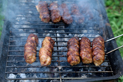 Close-up of meat on barbecue grill