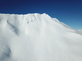 Snow covered mountain against sky