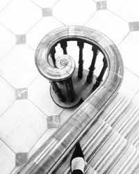 Low section of man standing on tiled floor