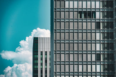 Low angle view of modern buildings against sky