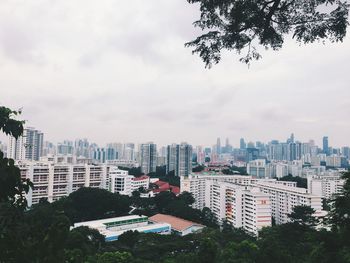 High angle view of buildings in city against sky